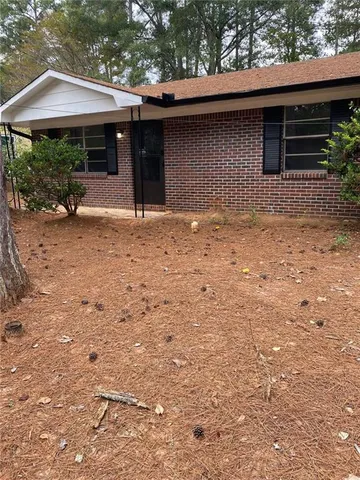 a backyard of a house with yard and garage