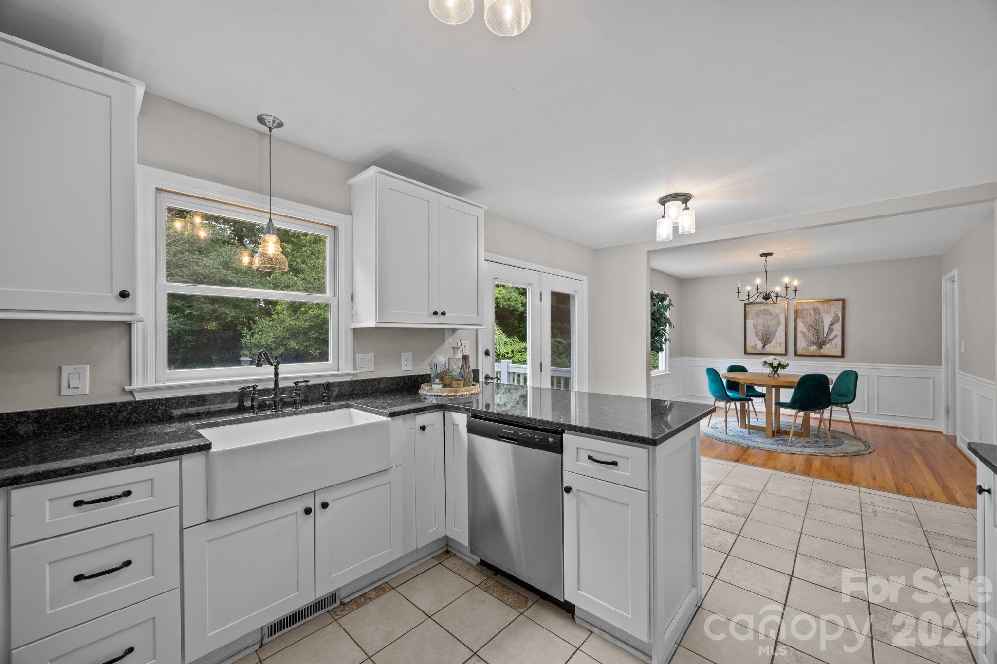 6 Springfield Way Arden, NC 28704 - Photo 18 of 47 a kitchen with a sink window and cabinets