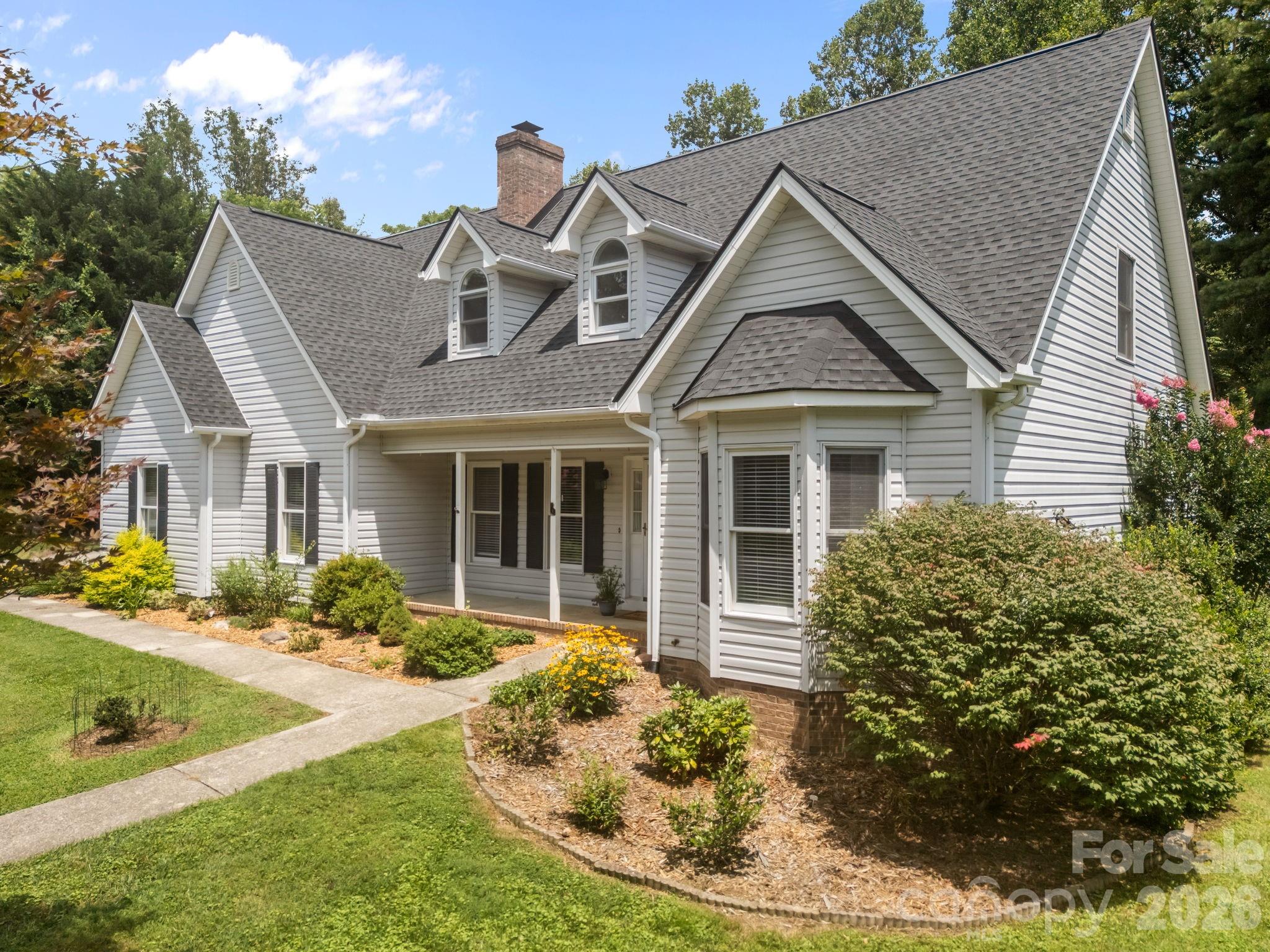 6 Springfield Way Arden, NC 28704 - Photo 2 of 47 a front view of a house with garden