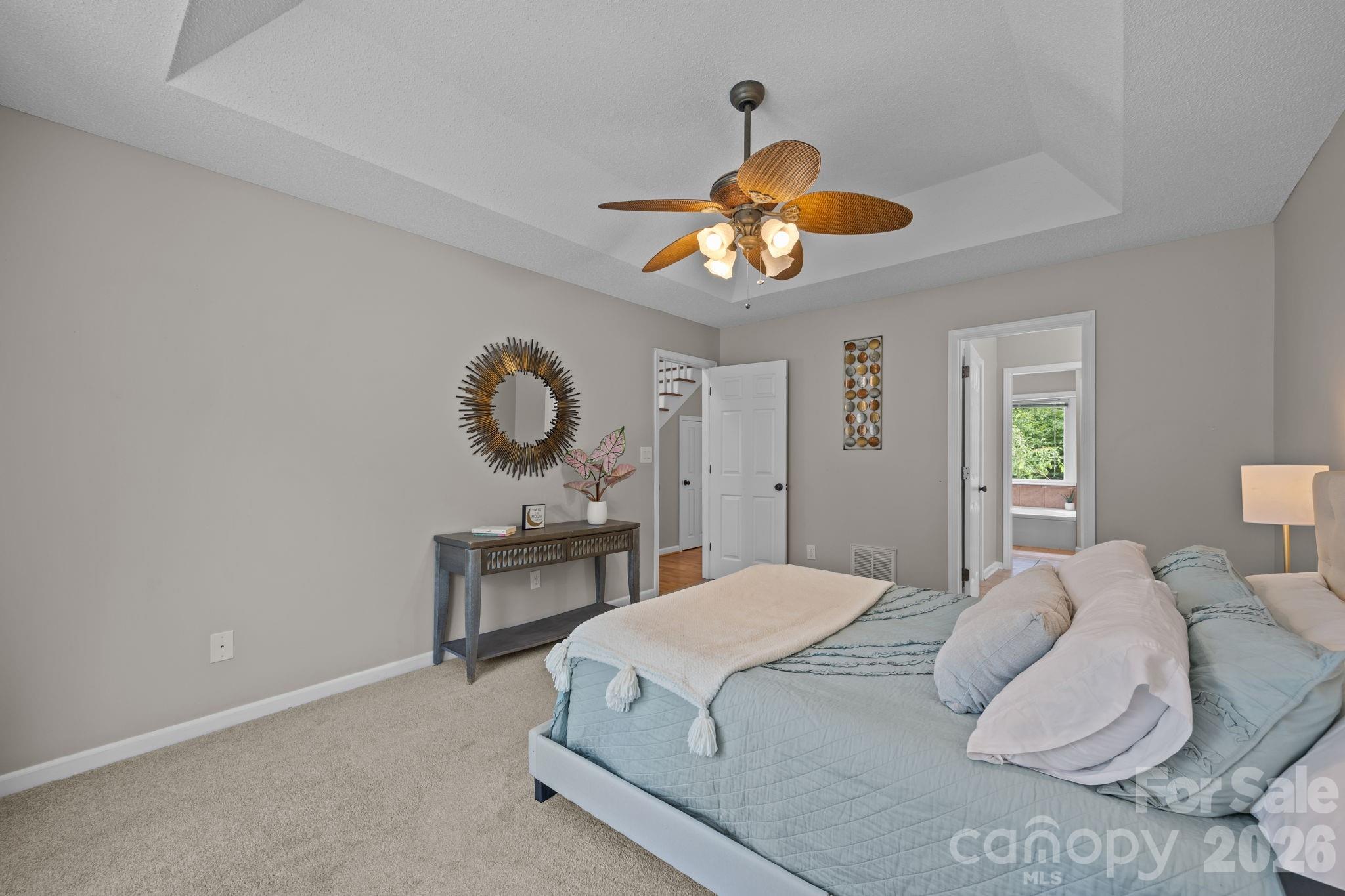 6 Springfield Way Arden, NC 28704 - Photo 22 of 47 a bedroom with a bed and chandelier