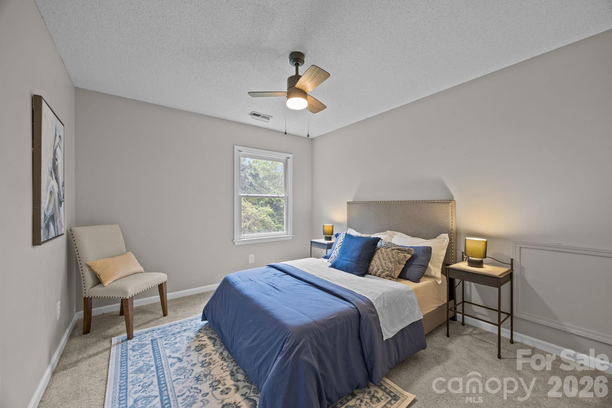 6 Springfield Way Arden, NC 28704 - Photo 26 of 47 a bedroom with a bed lamps and a window