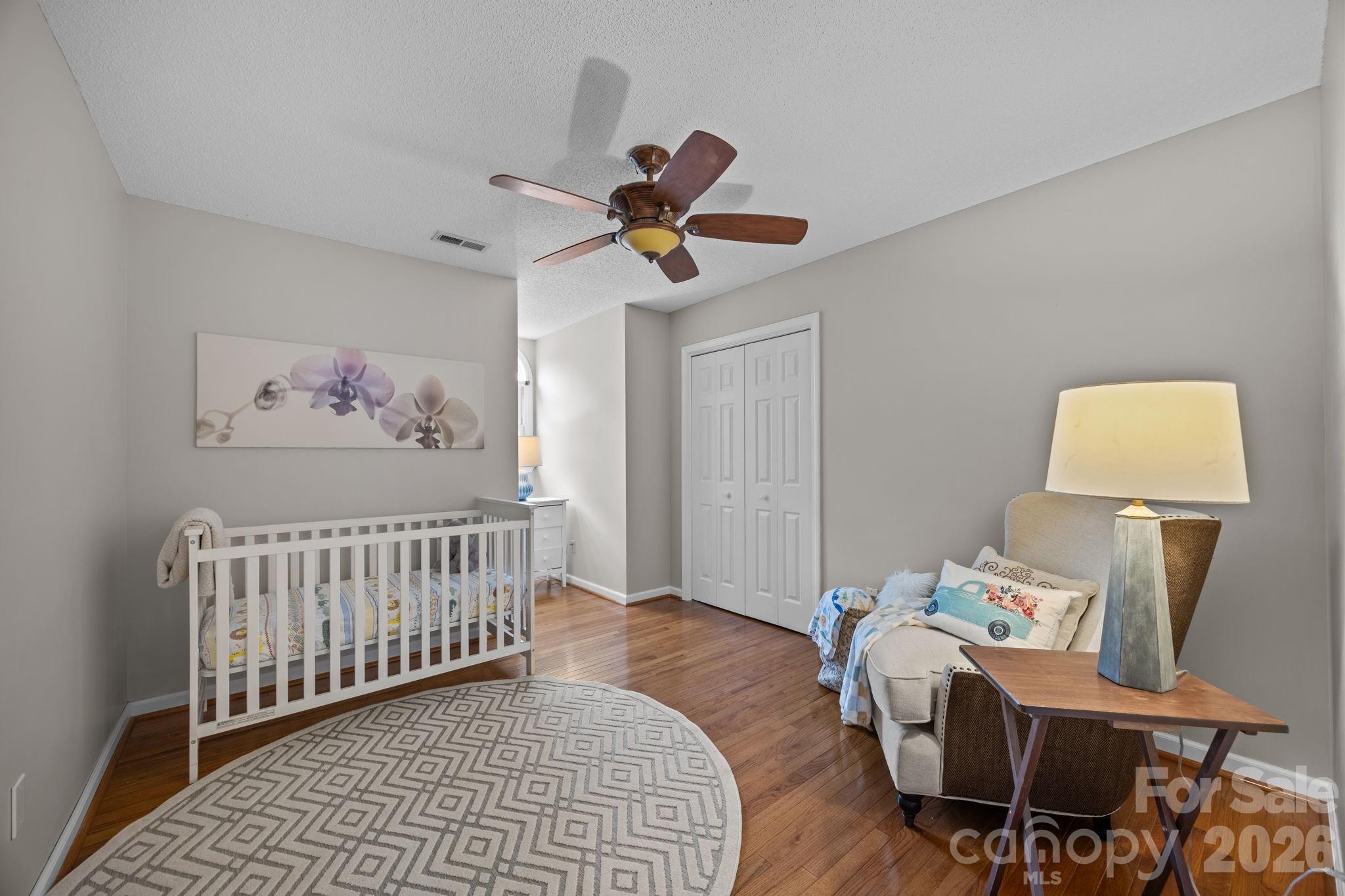 6 Springfield Way Arden, NC 28704 - Photo 27 of 47 a bedroom with furniture and wooden floor