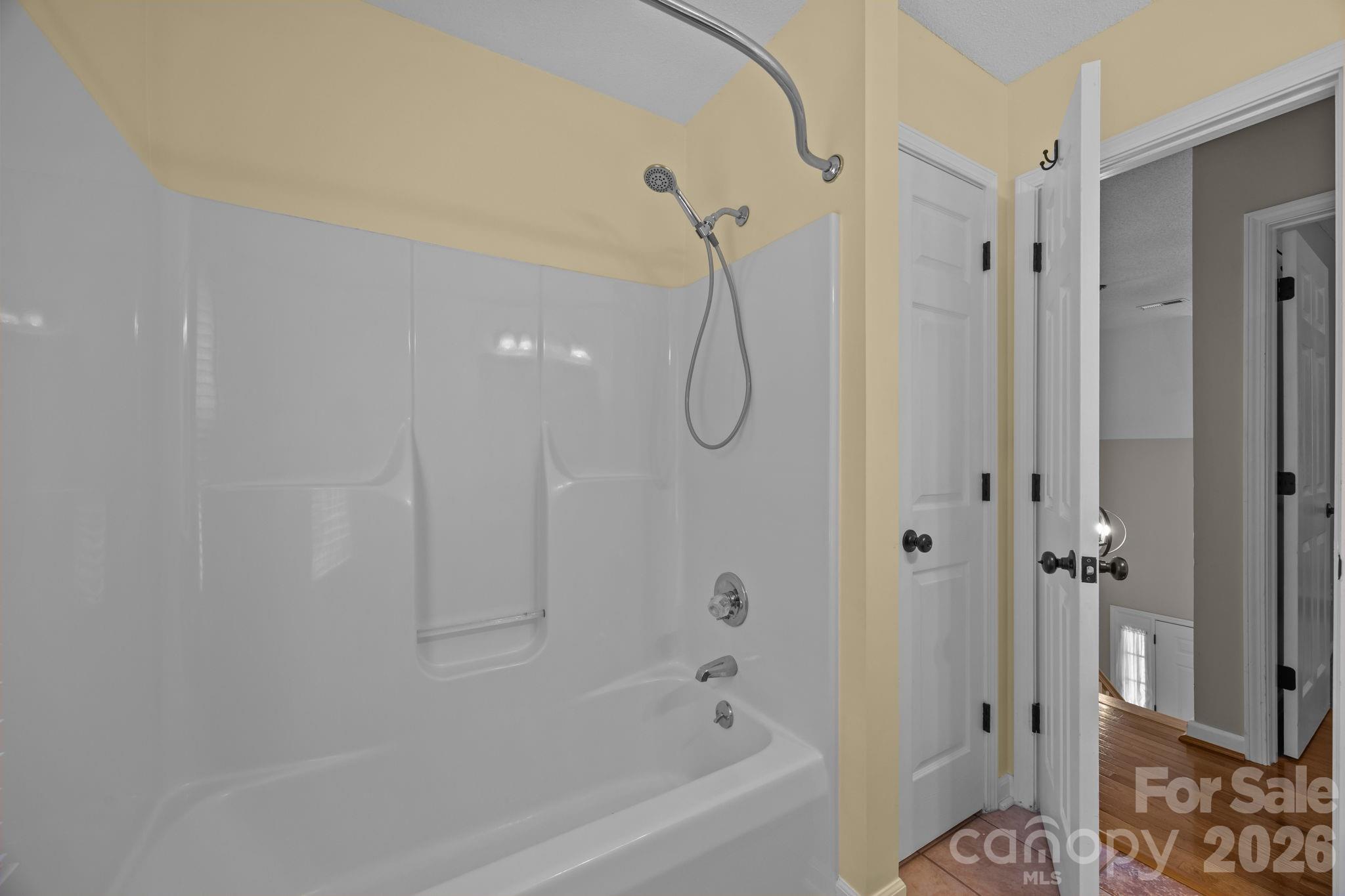 6 Springfield Way Arden, NC 28704 - Photo 29 of 47 a bathroom with a bathtub and shower