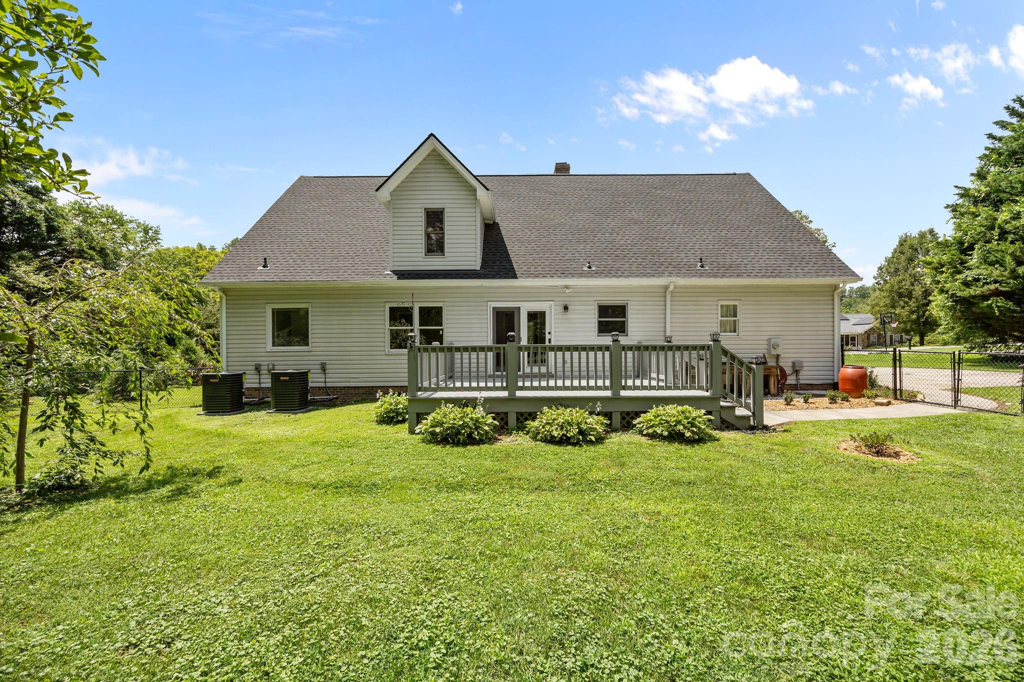 6 Springfield Way Arden, NC 28704 - Photo 41 of 47 a view of a house with a big yard plants and large trees