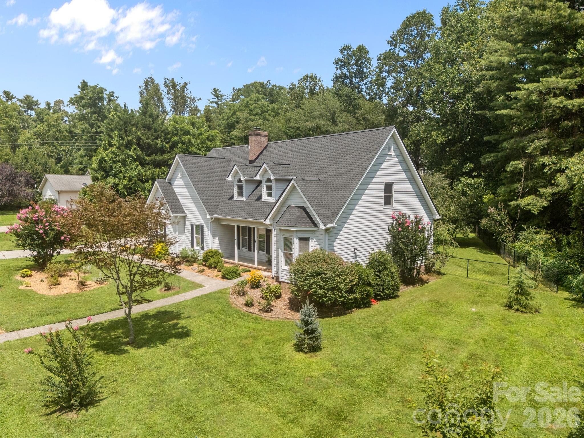 6 Springfield Way Arden, NC 28704 - Photo 42 of 47 a view of house with garden and tall trees