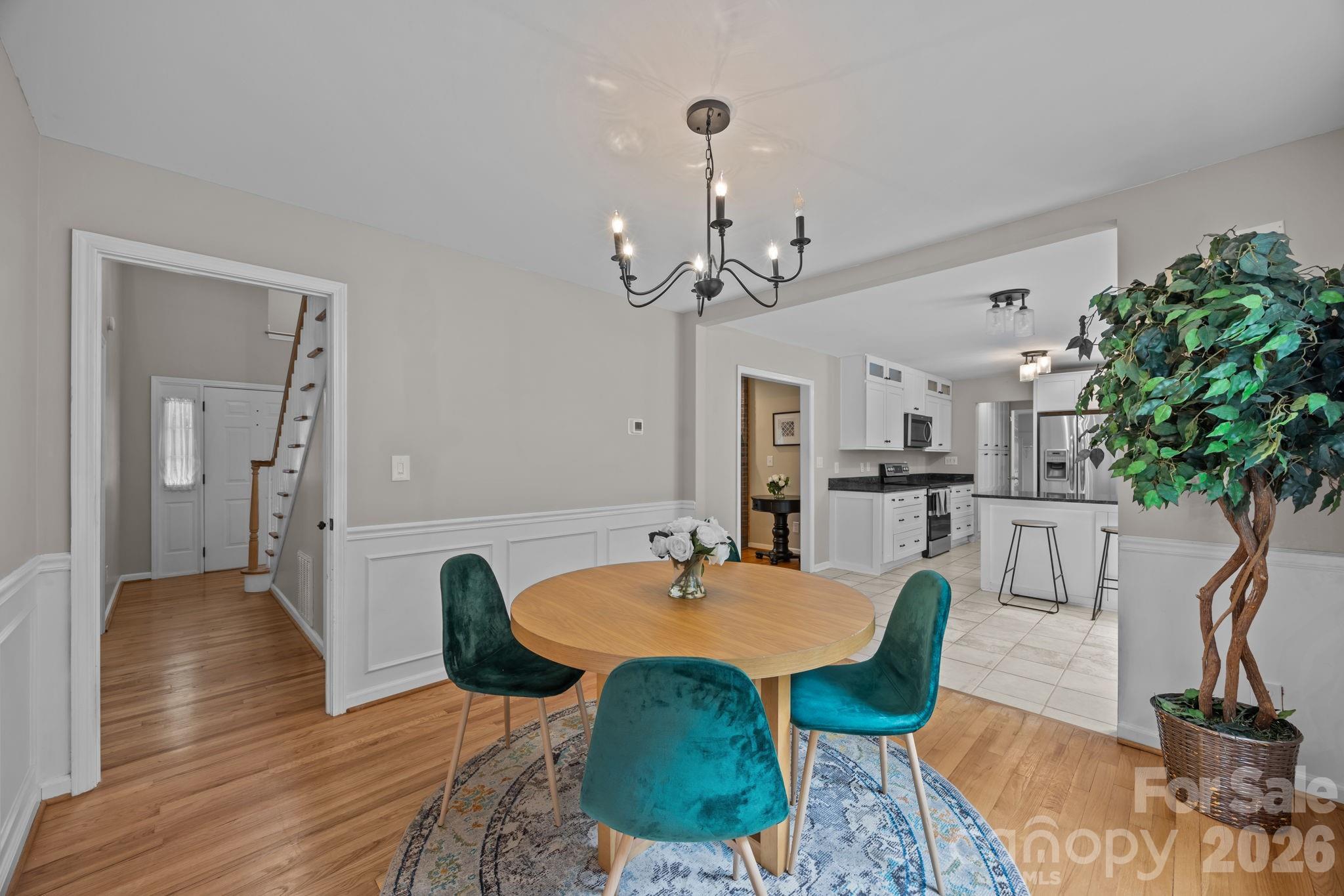 6 Springfield Way Arden, NC 28704 - Photo 9 of 47 a view of a dining room with furniture and wooden floor