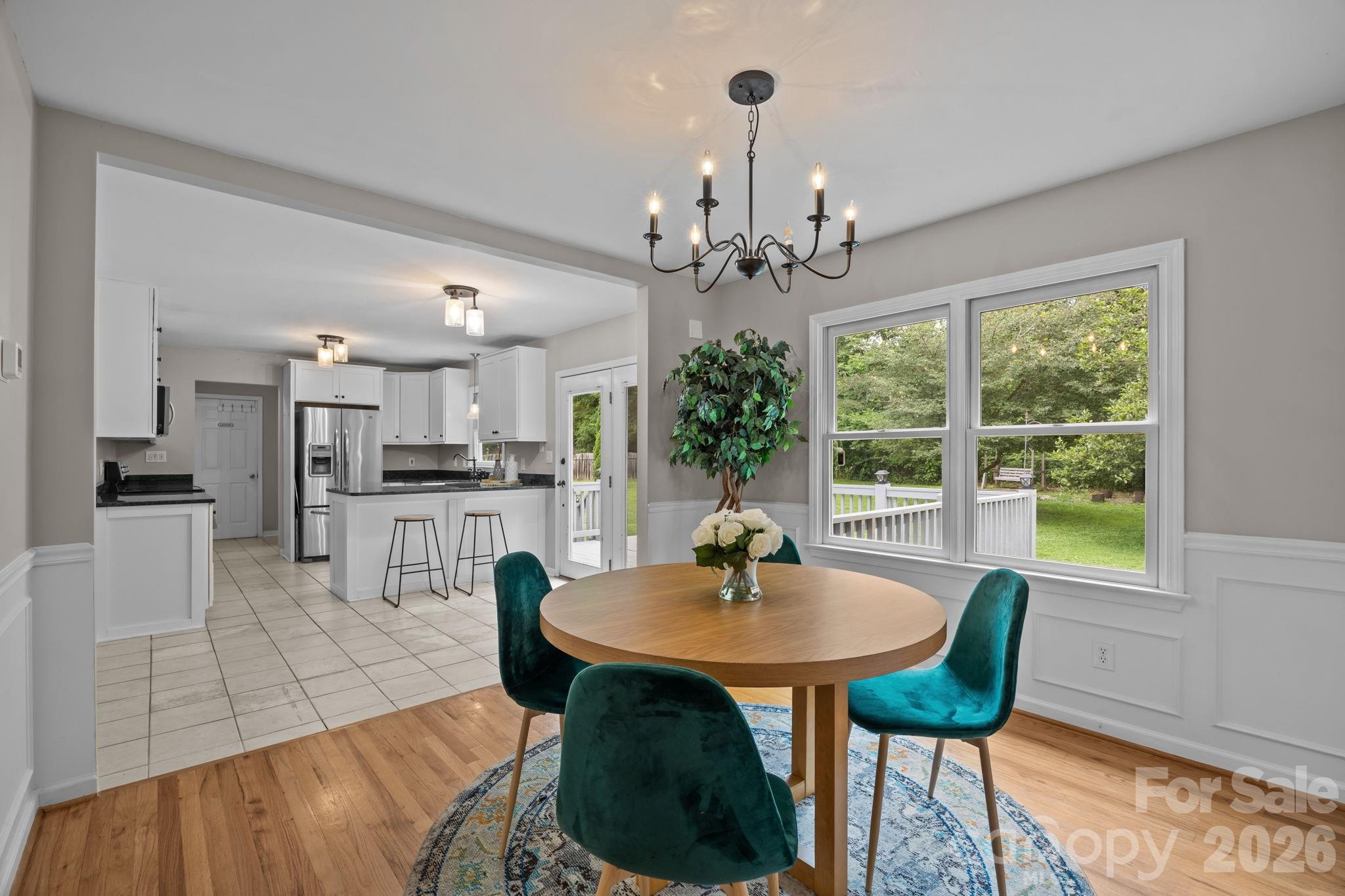 6 Springfield Way Arden, NC 28704 - Photo 10 of 47 a view of a dining room with furniture and a chandelier
