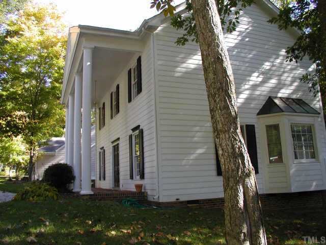 7124 Kinross Drive Raleigh, NC 27613 - Photo 1 of 1 a view of a house with a yard