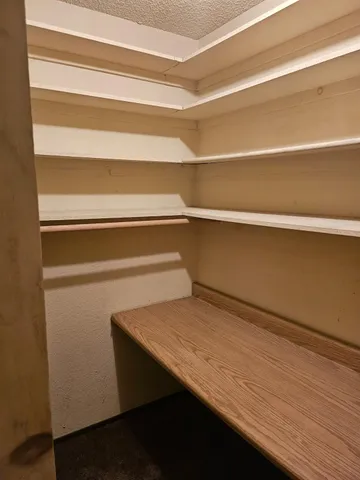 a view of small space with racks on the wall