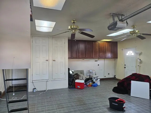 a view of a room with gym equipment and a window