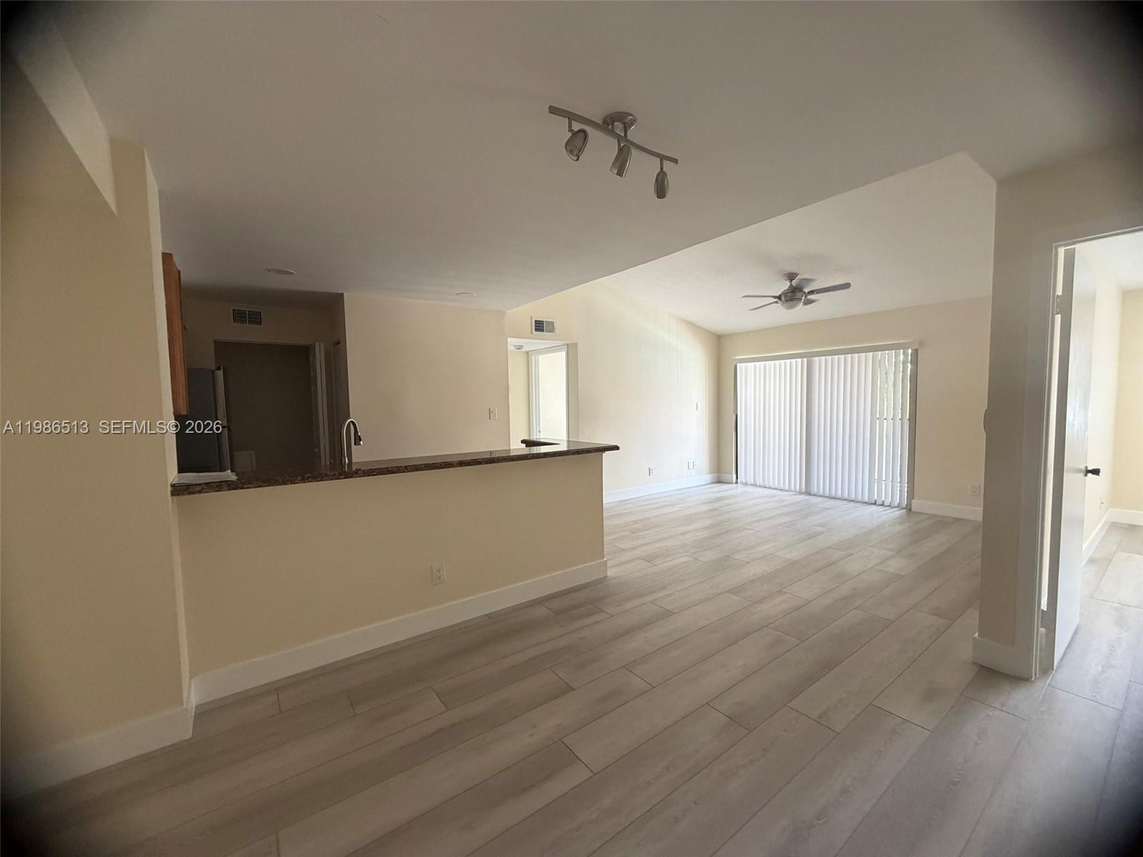 560 South Park Road, Unit 367 Hollywood, FL 33021 - Photo 13 of 28 a view of an empty room with wooden floor and a window