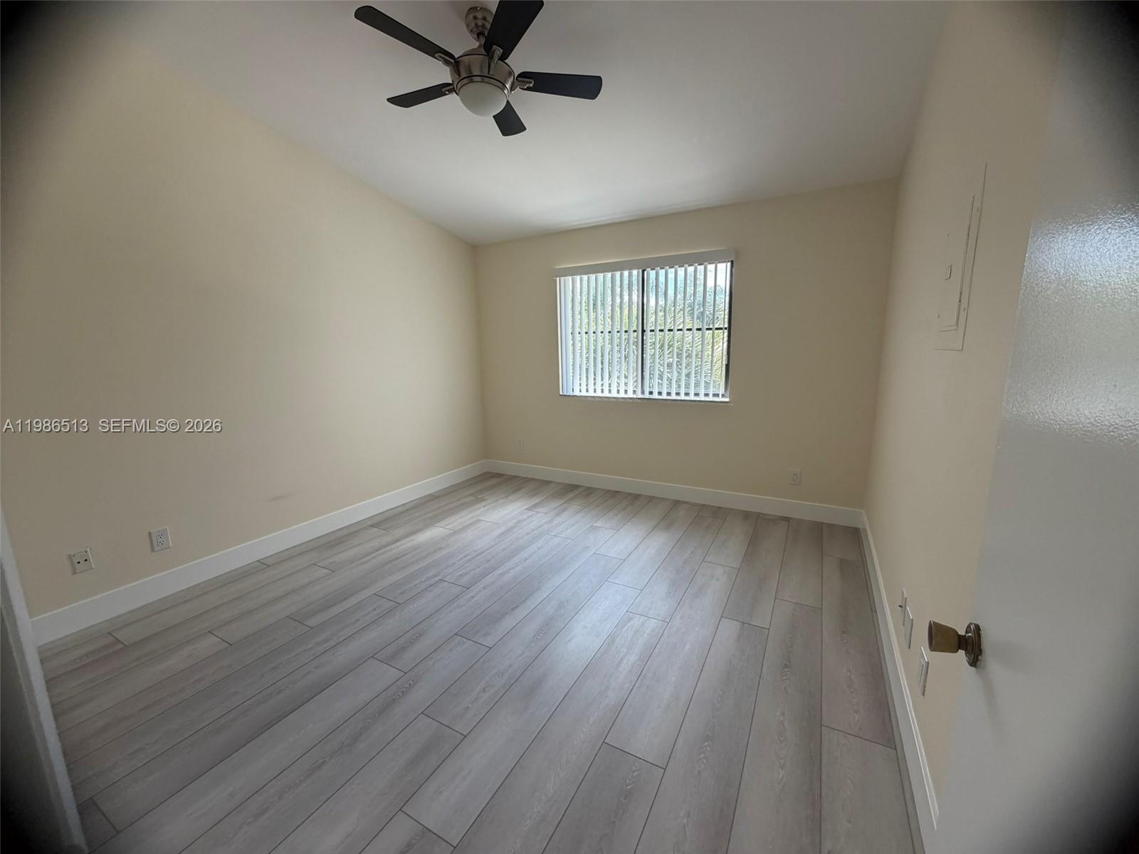 560 South Park Road, Unit 367 Hollywood, FL 33021 - Photo 14 of 28 wooden floor in an empty room with a window