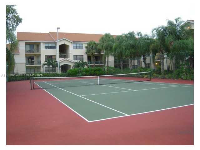 560 South Park Road, Unit 367 Hollywood, FL 33021 - Photo 20 of 28 a view of a tennis ground with large trees