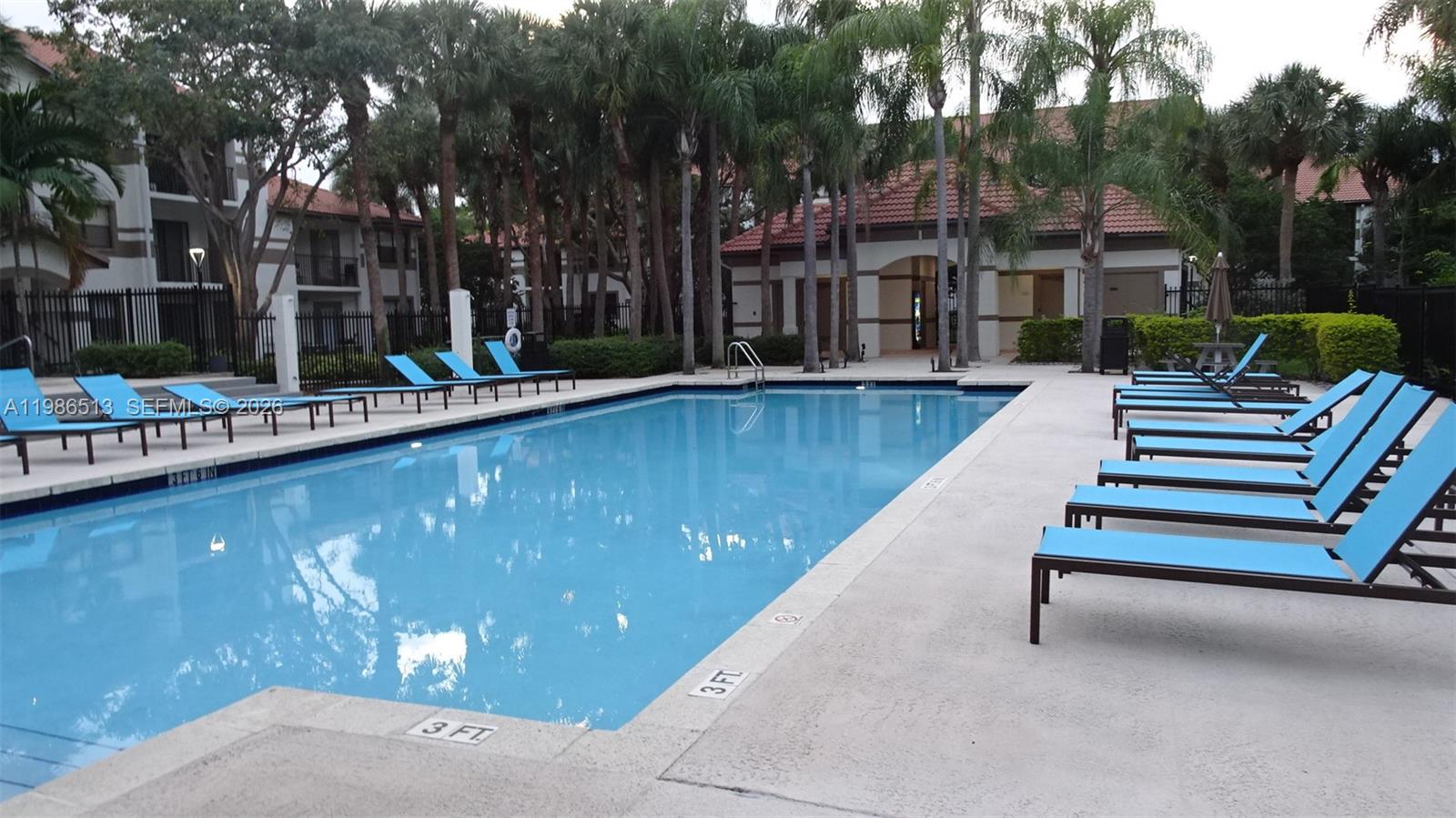 560 South Park Road, Unit 367 Hollywood, FL 33021 - Photo 24 of 28 a view of swimming pool with outdoor seating and plants