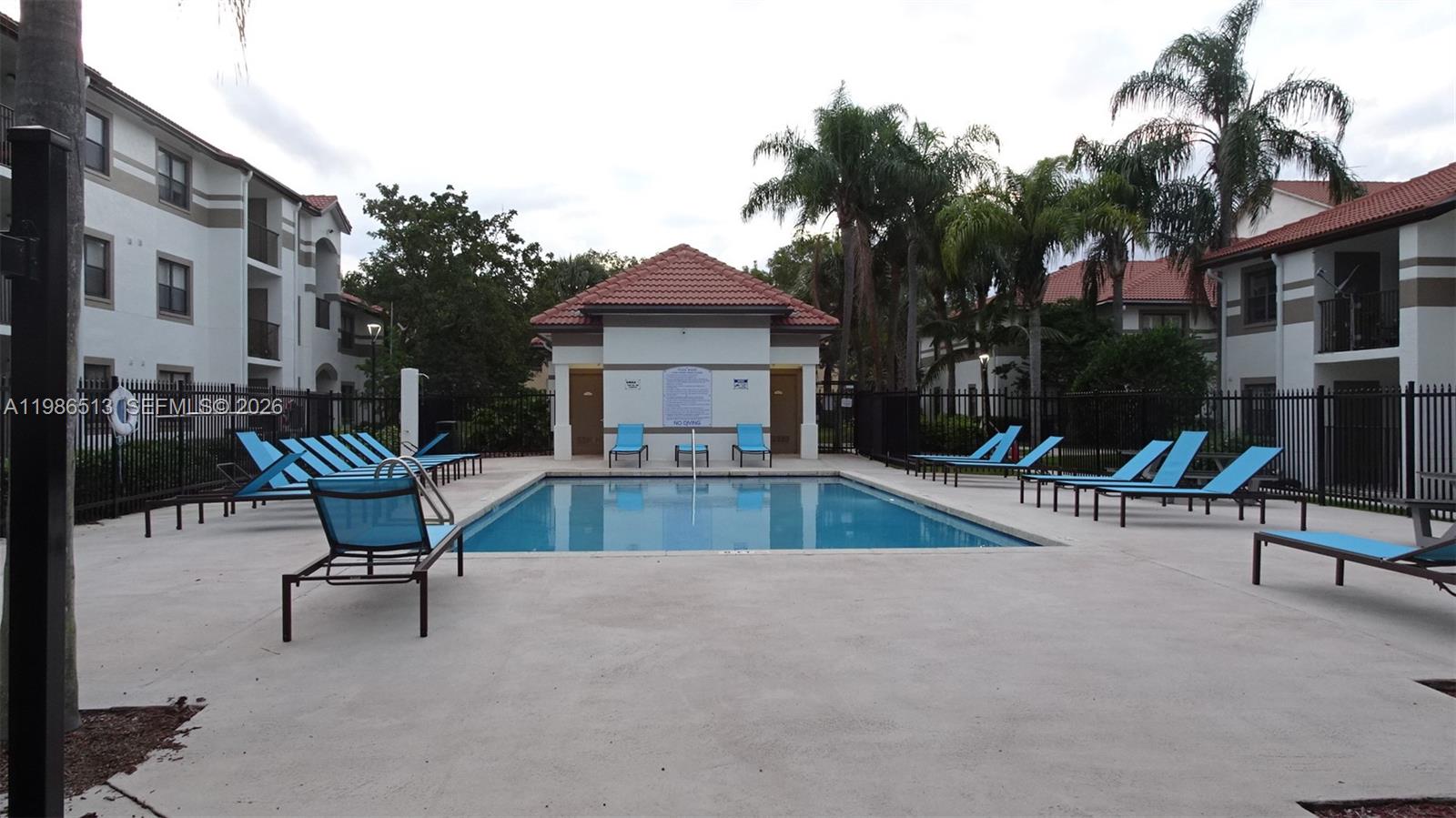 560 South Park Road, Unit 367 Hollywood, FL 33021 - Photo 27 of 28 a view of a swimming pool with a lounge chair