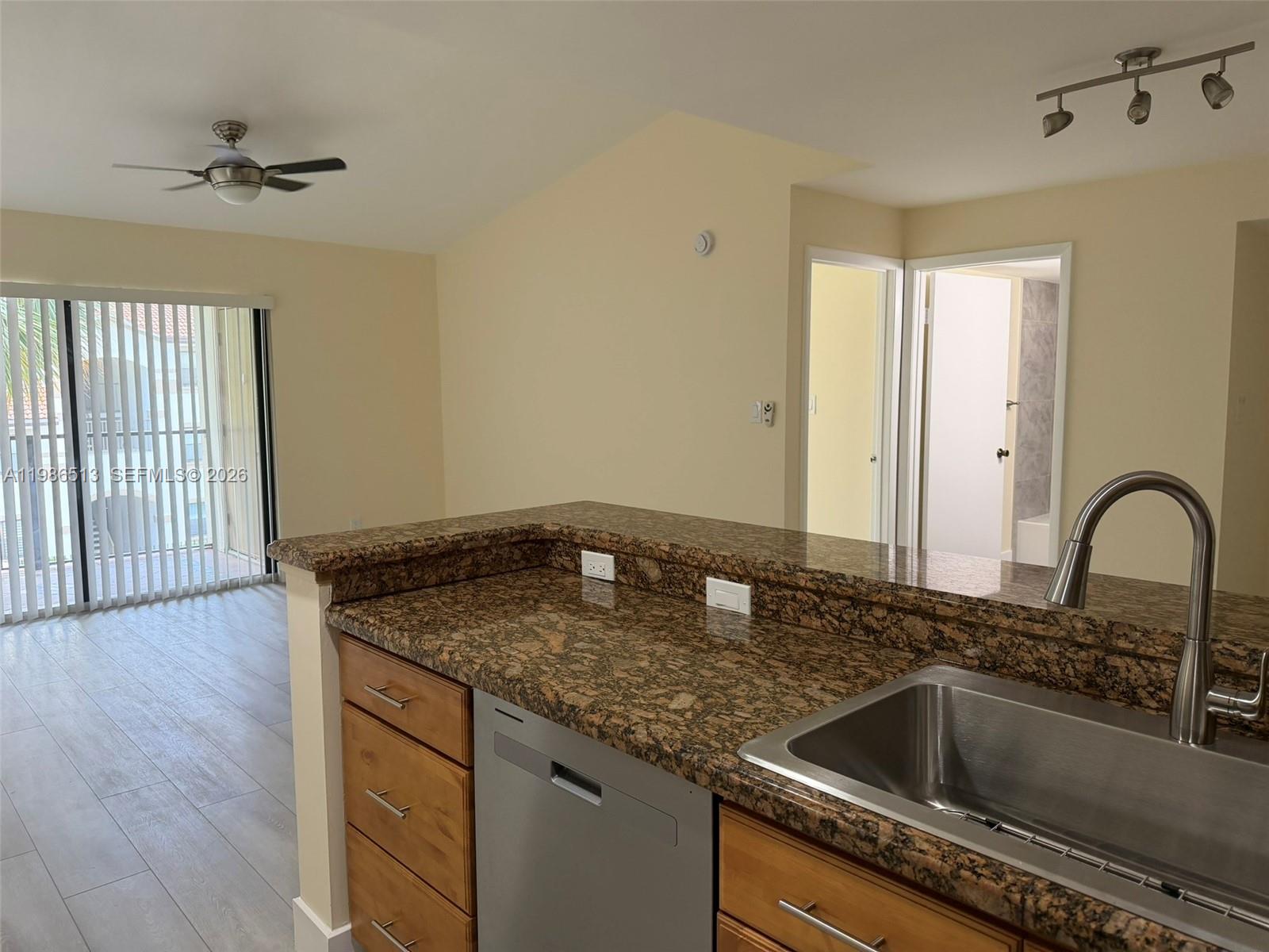 560 South Park Road, Unit 367 Hollywood, FL 33021 - Photo 7 of 28 a kitchen with granite countertop a sink and a stove