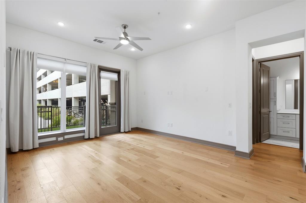 2700 Old Denton Road, Unit 1044 Carrollton, TX 75007 - Photo 22 of 39 a view of an empty room with glass door and a window