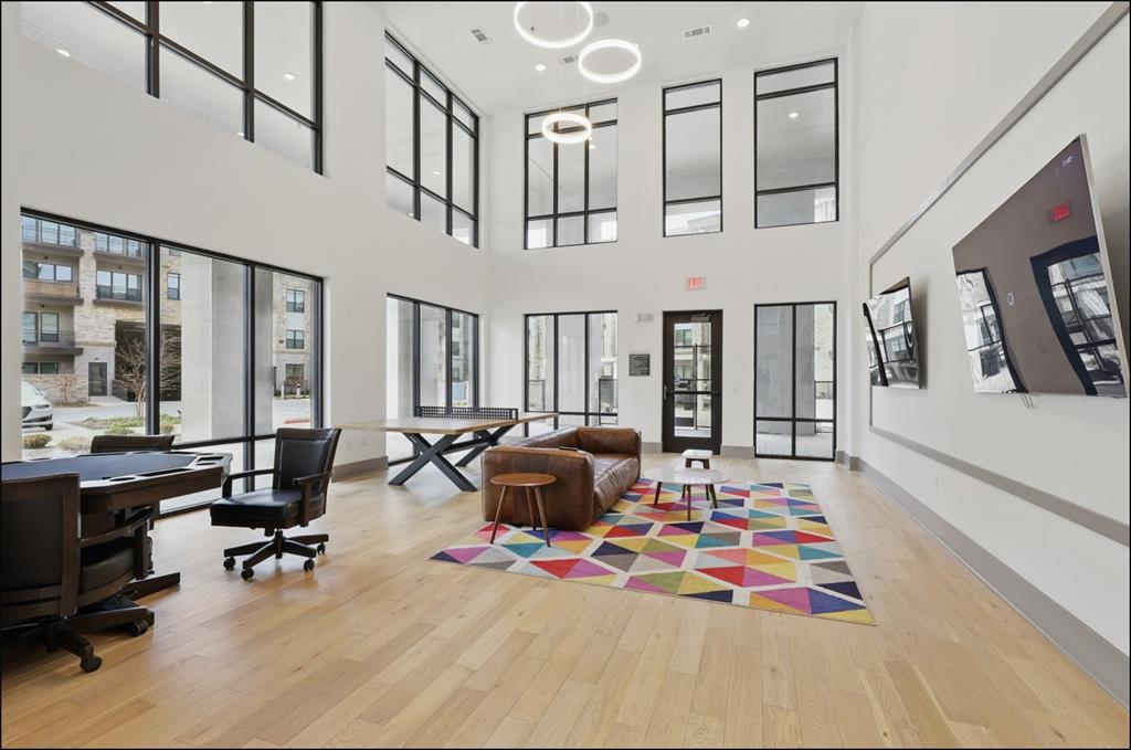 2700 Old Denton Road, Unit 1044 Carrollton, TX 75007 - Photo 28 of 39 a living room with furniture fireplace and rug floor