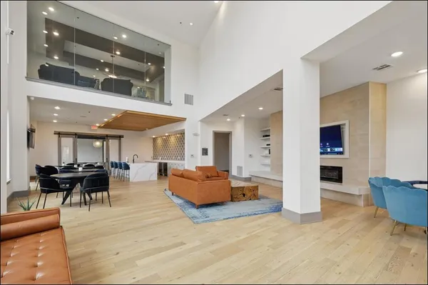 a living room with furniture and kitchen view