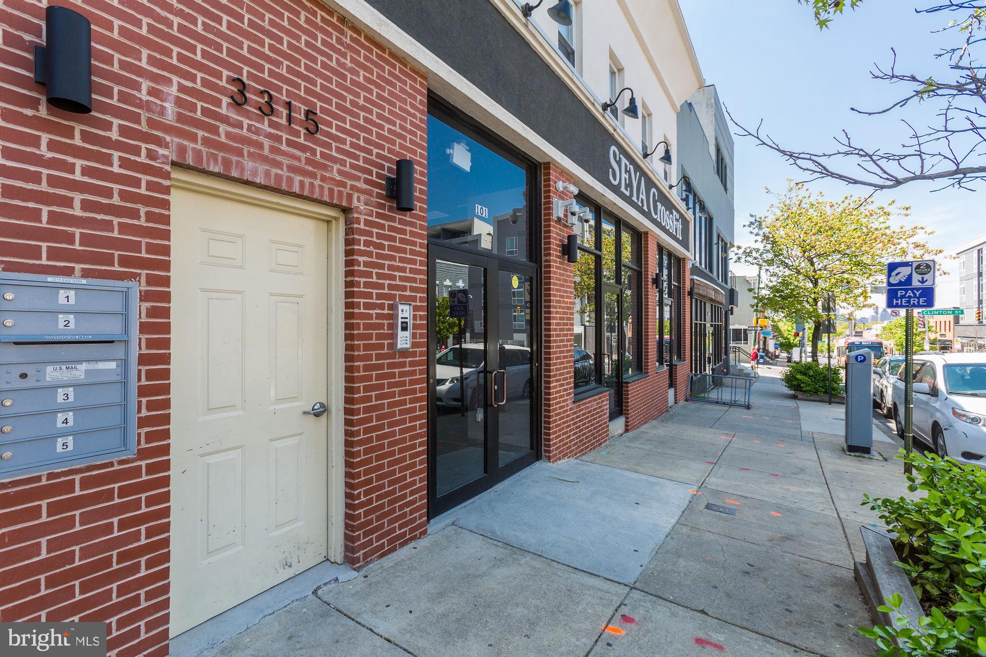 3315 Eastern Avenue, Unit 203 Baltimore, MD 21224 - Photo 1 of 13 a view of path along with building