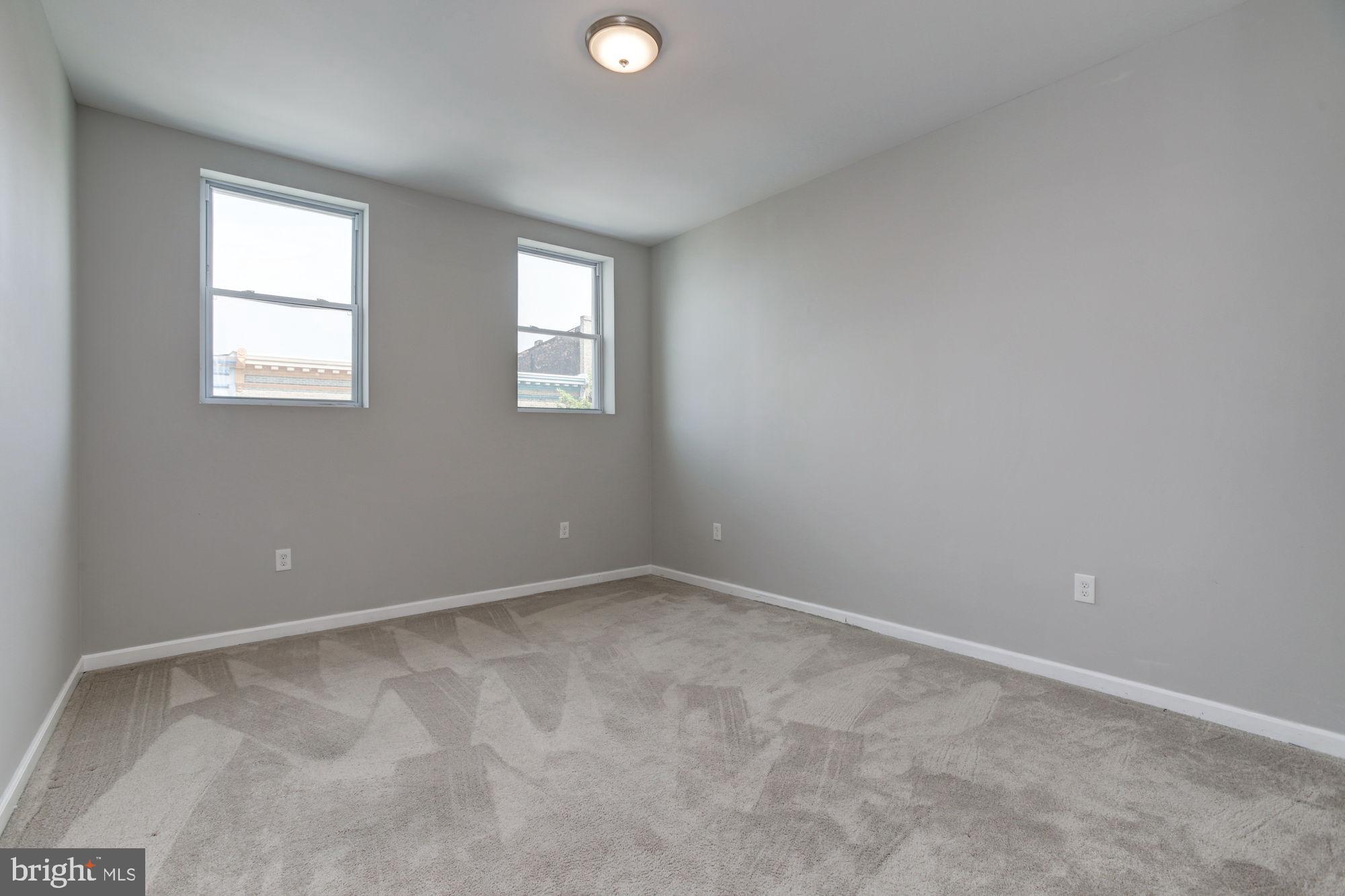 3315 Eastern Avenue, Unit 203 Baltimore, MD 21224 - Photo 12 of 13 an empty room with windows