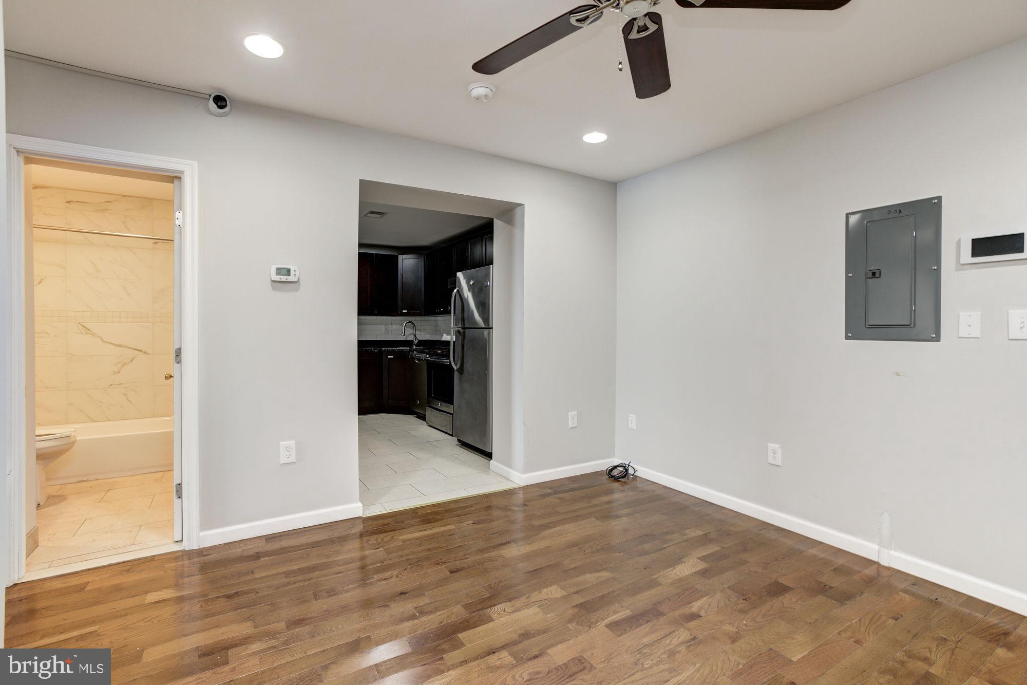 3315 Eastern Avenue, Unit 203 Baltimore, MD 21224 - Photo 3 of 13 wooden floor in an empty room