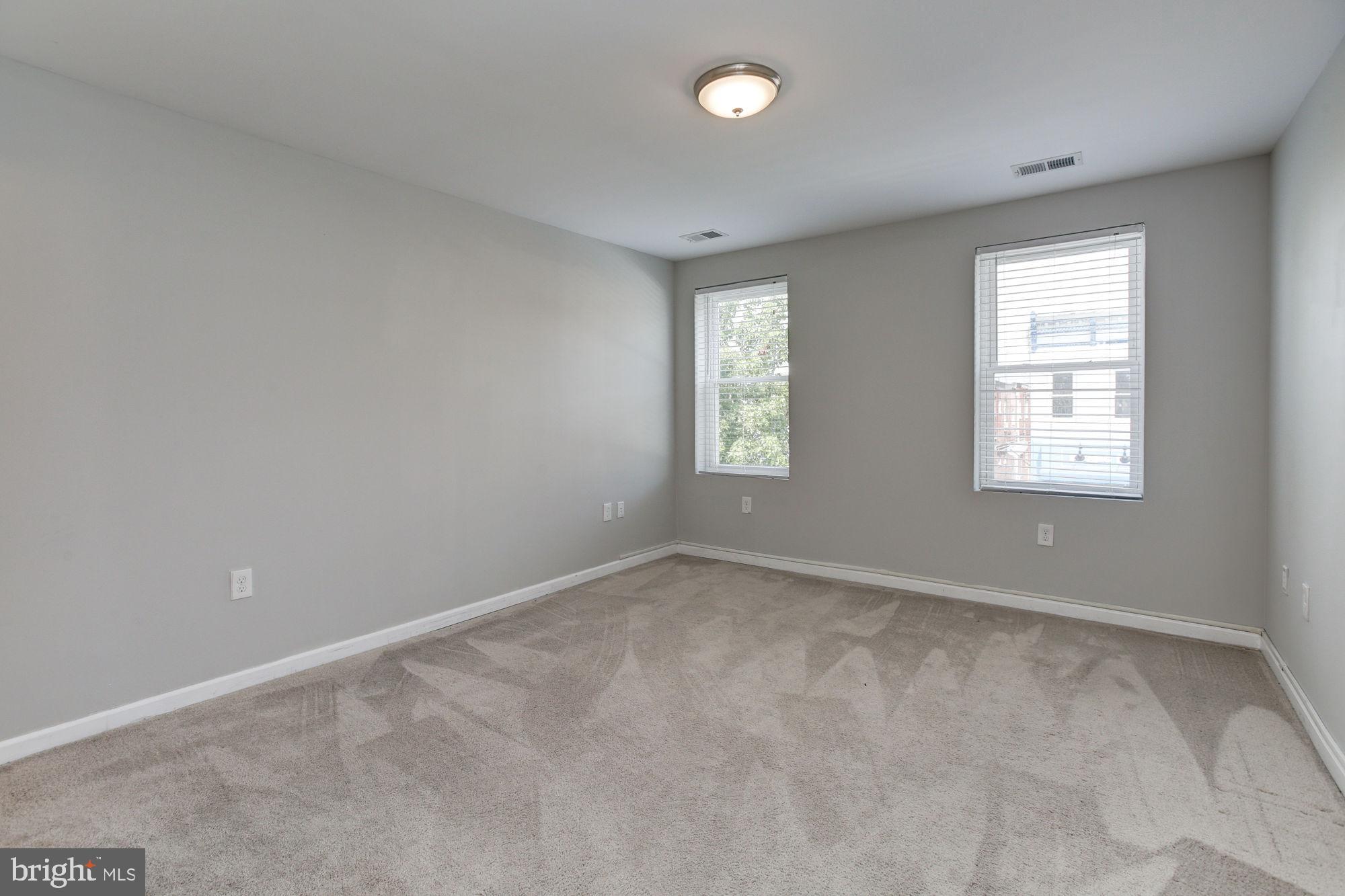 3315 Eastern Avenue, Unit 203 Baltimore, MD 21224 - Photo 8 of 13 an empty room with windows