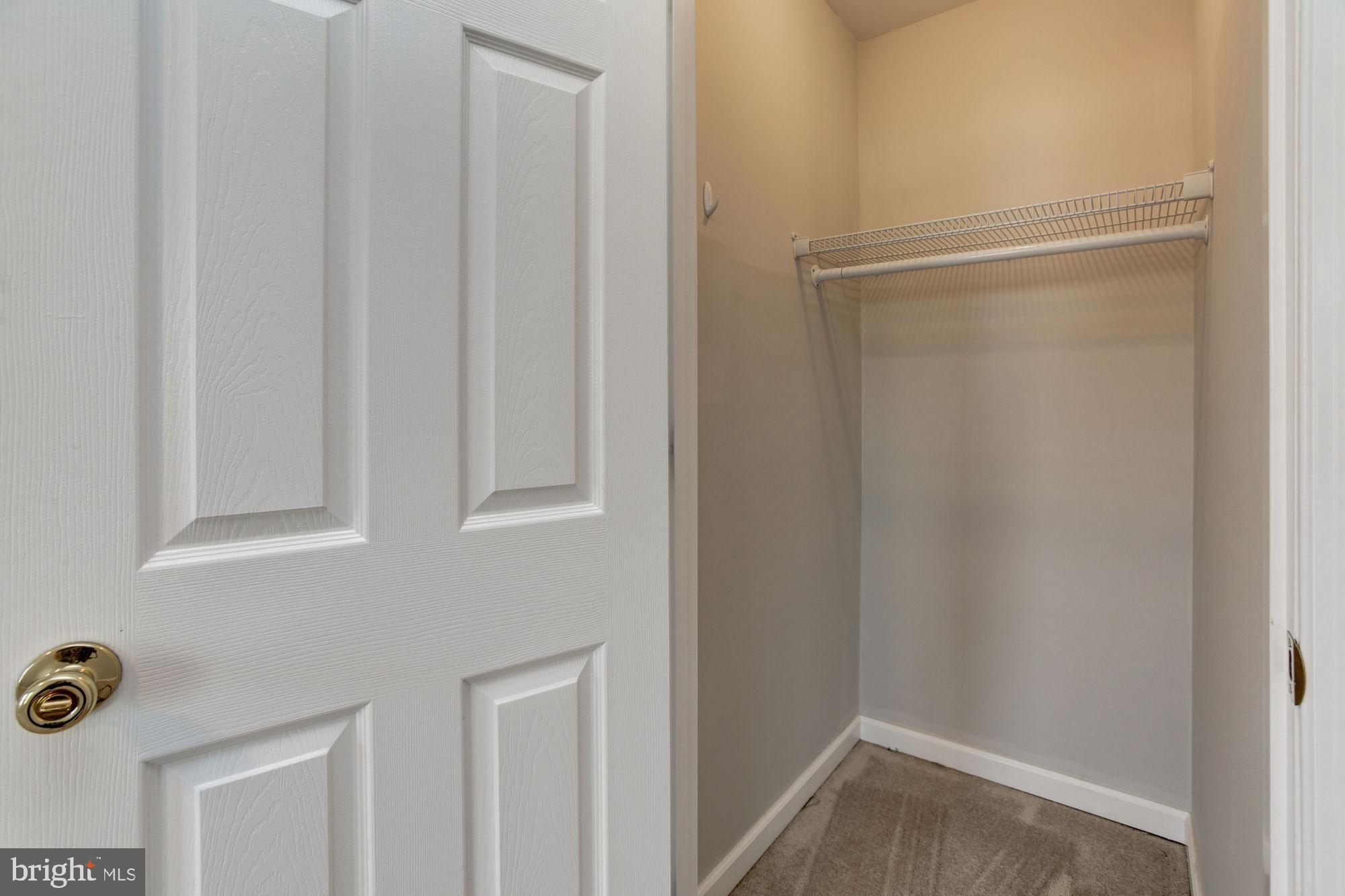 3315 Eastern Avenue, Unit 203 Baltimore, MD 21224 - Photo 10 of 13 a bathroom with a glass shower door