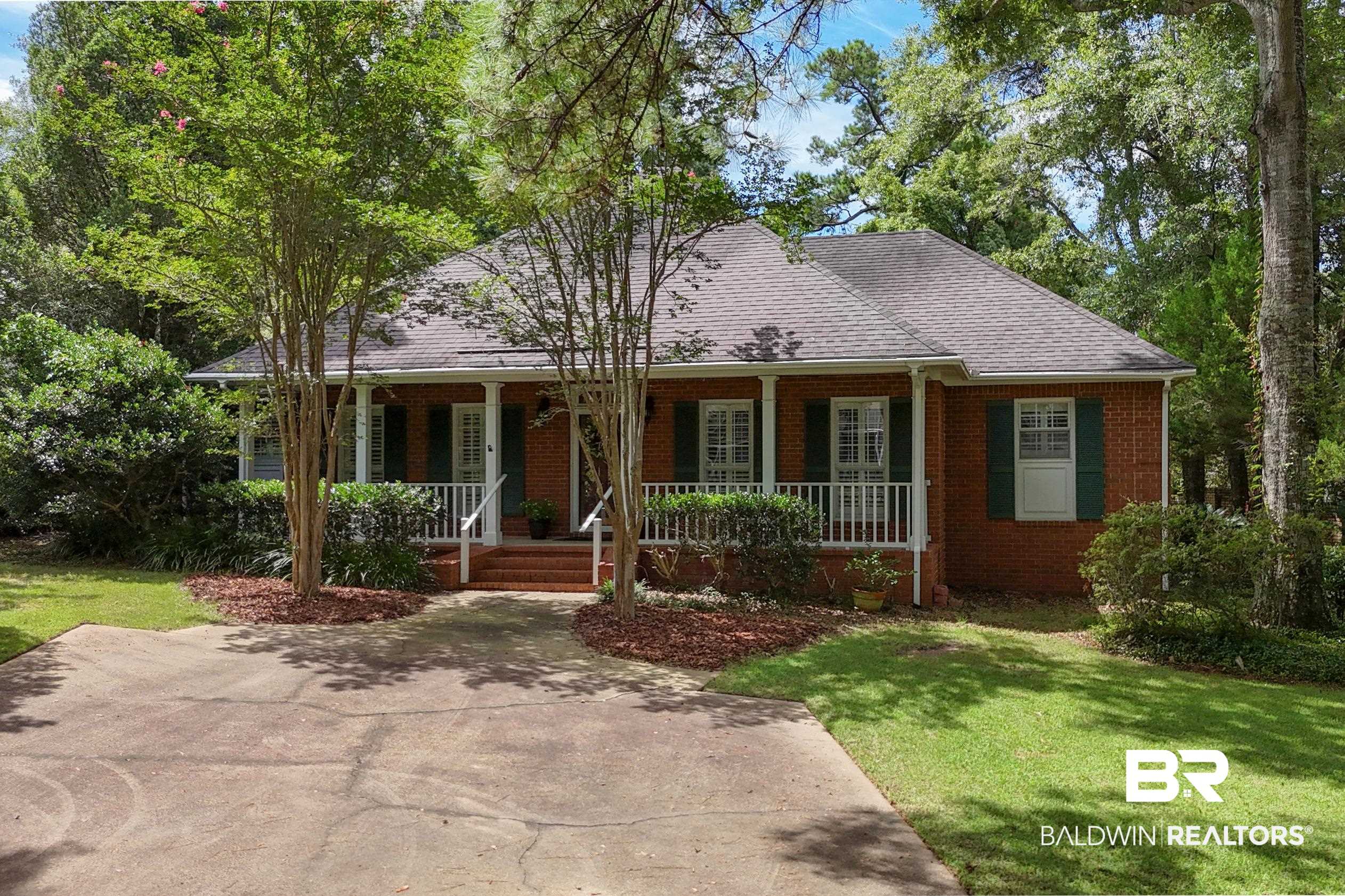 6638 Jackson Square Daphne, AL 36526 - Photo 49 of 62 View of front of home featuring a front lawn and covered porch
