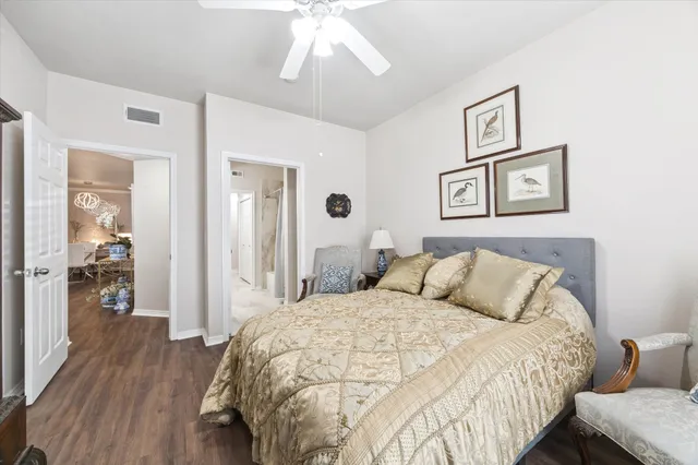 a bed room with a bed and a chair