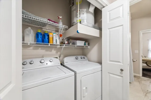 a bathroom with a tub sink shower and mirror