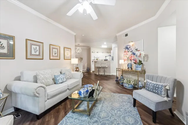 a living room with furniture and a painting