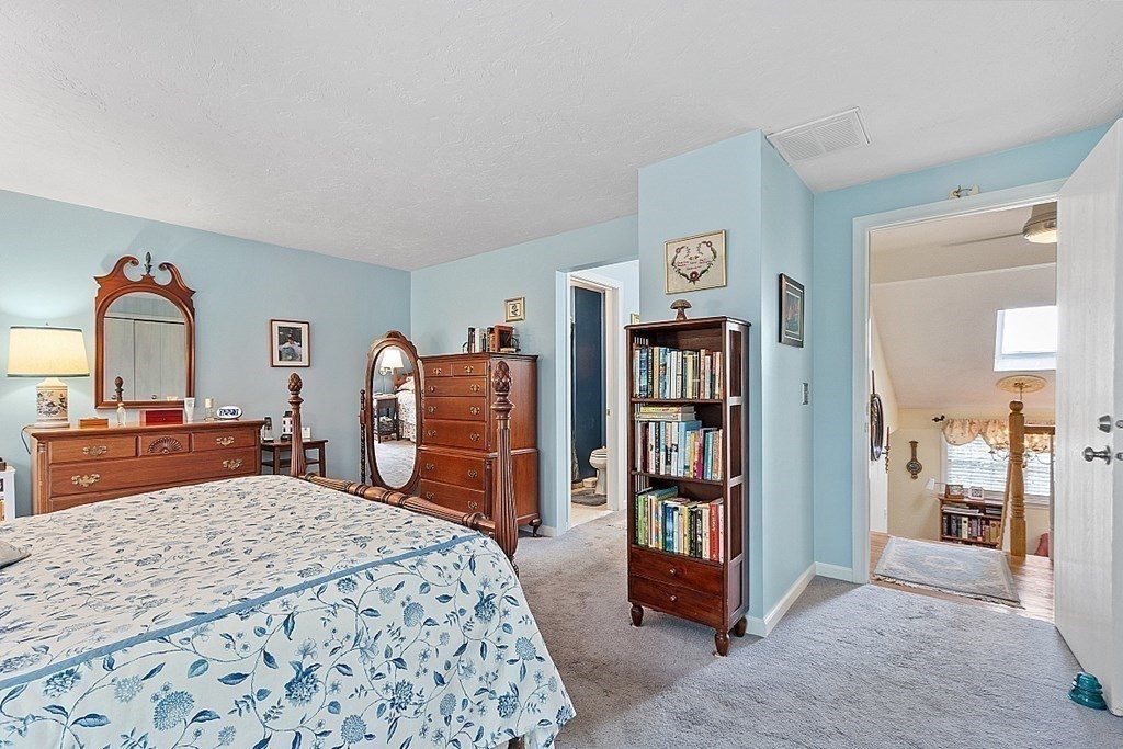109 C Ridgefield Circle, Unit C Clinton, MA 01510 - Photo 24 of 39 a bedroom with a bed and dresser