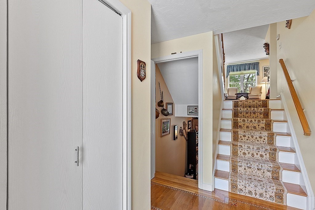 109 C Ridgefield Circle, Unit C Clinton, MA 01510 - Photo 3 of 39 a view of a hallway with wooden floor and entryway