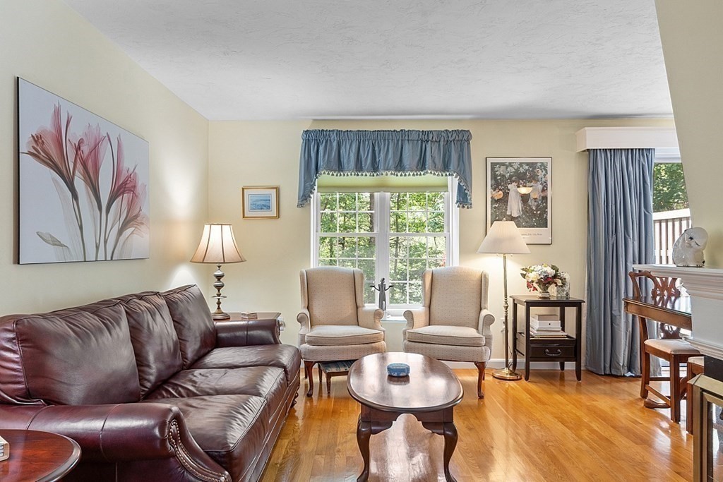 109 C Ridgefield Circle, Unit C Clinton, MA 01510 - Photo 5 of 39 a living room with furniture and a large window