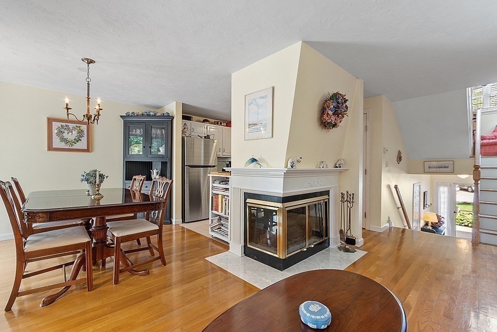 109 C Ridgefield Circle, Unit C Clinton, MA 01510 - Photo 7 of 39 a living room with furniture a flat screen tv and a fireplace