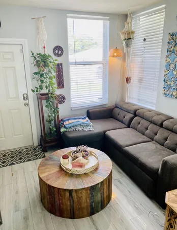 a living room with furniture and a large window