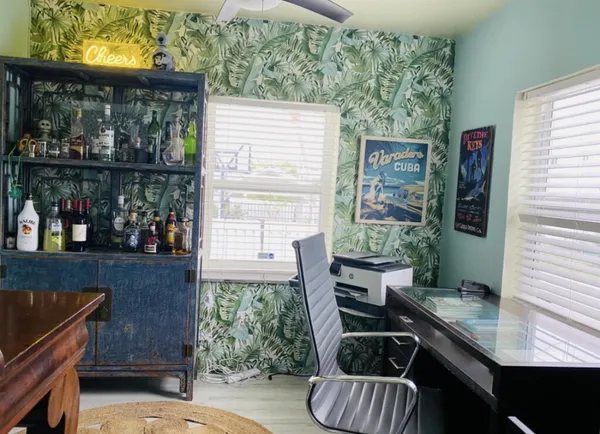 a kitchen with stainless steel appliances kitchen island granite countertop a sink and cabinets