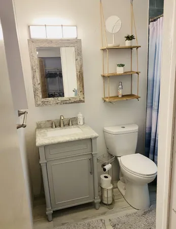 a bedroom with a bed and a closet