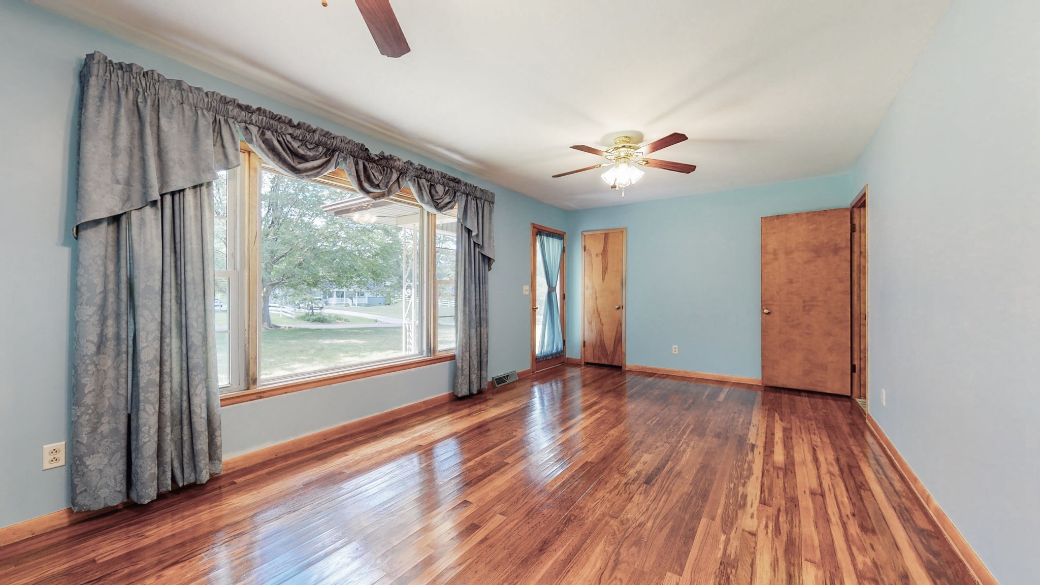 37 Horseshoe Bend Road Leoma, TN 38468 - Photo 3 of 35 a view of an empty room with a window and wooden floor