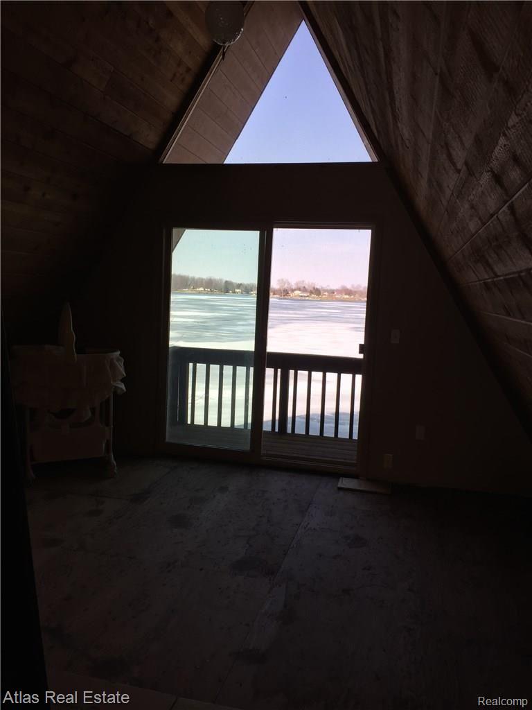 9519 Ridge Road Goodrich, MI 48438 - Photo 16 of 25 View of lake from upper level loft