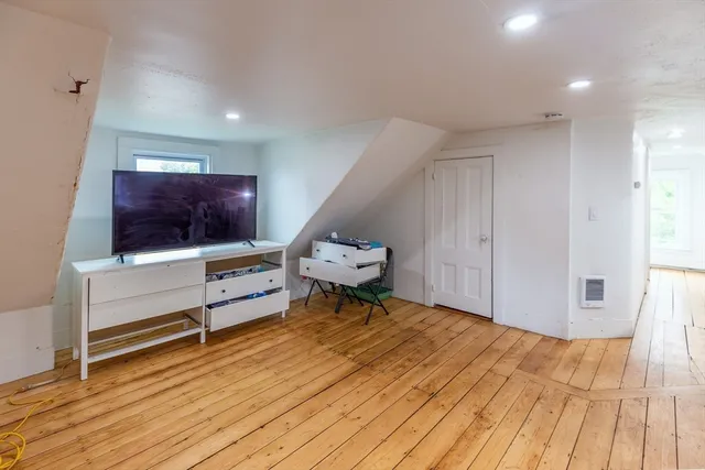 a view of a balcony with wooden fence