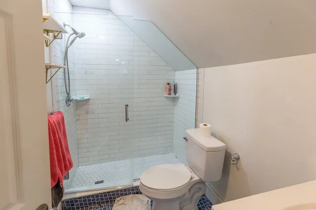 an aerial view of a house with outdoor space and street view