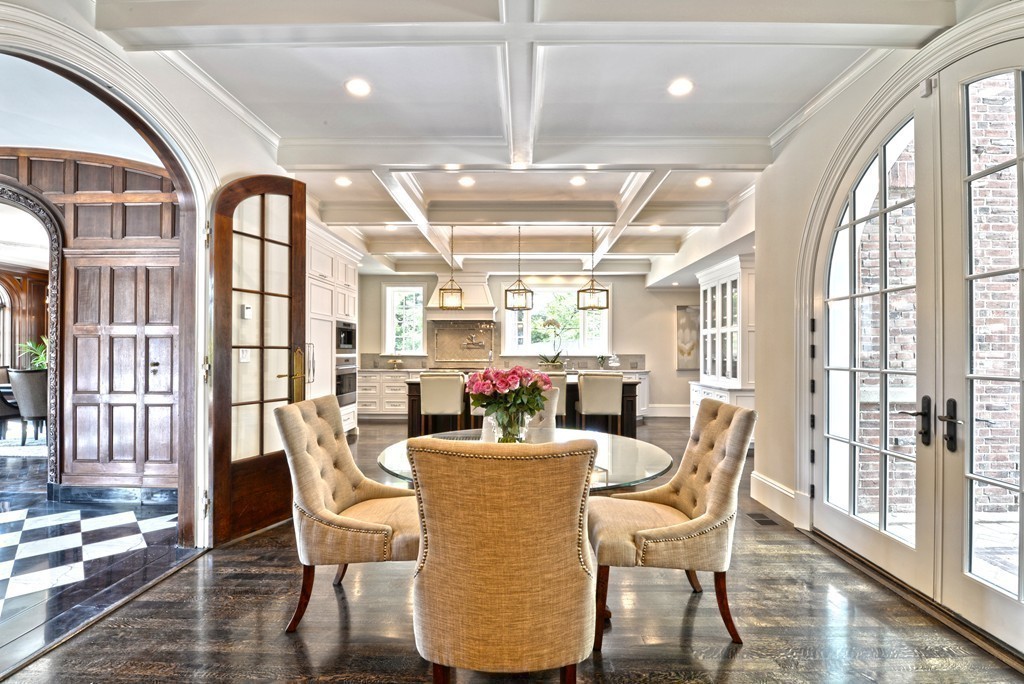 201 Hyslop Road Brookline, MA 02445 - Photo 12 of 30 a dining room with furniture a chandelier and wooden floor