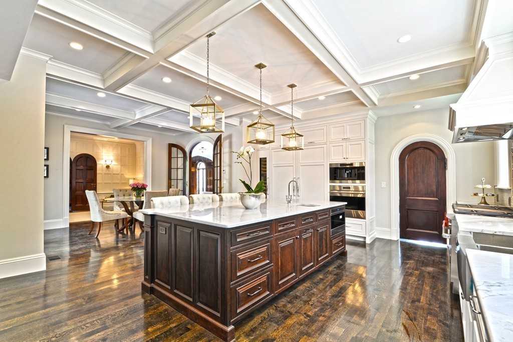 201 Hyslop Road Brookline, MA 02445 - Photo 13 of 30 a kitchen with stainless steel appliances granite countertop a lot of counter space and wooden floors