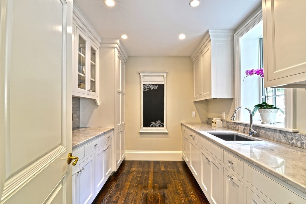 201 Hyslop Road Brookline, MA 02445 - Photo 15 of 30 a bathroom with a sink a mirror and a shower