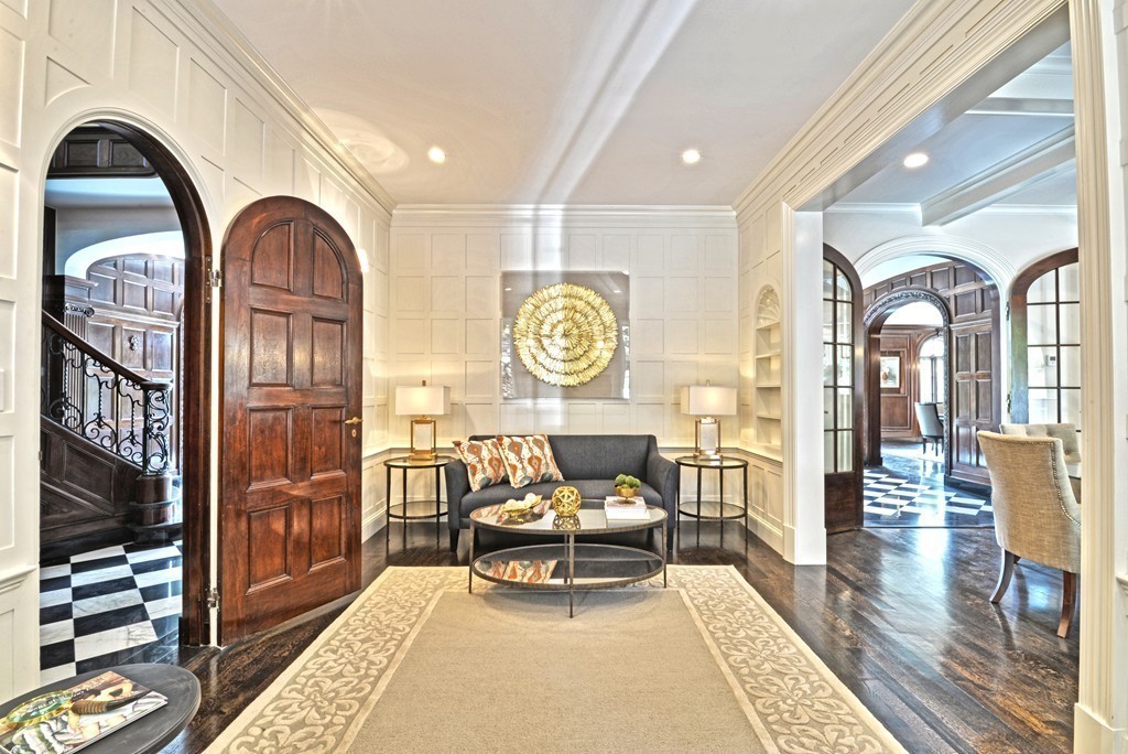 201 Hyslop Road Brookline, MA 02445 - Photo 19 of 30 a living room with furniture a rug and wall paintings