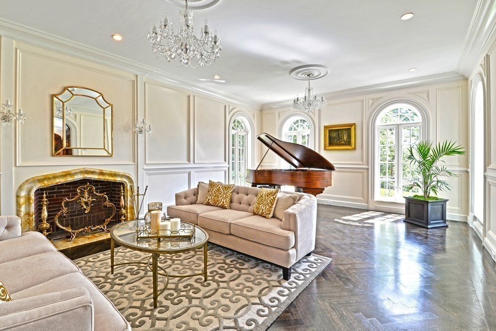 201 Hyslop Road Brookline, MA 02445 - Photo 9 of 30 a living room with furniture a chandelier and wooden floor