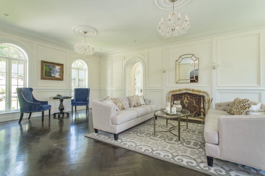 201 Hyslop Road Brookline, MA 02445 - Photo 10 of 30 a living room with furniture a chandelier and wooden floor