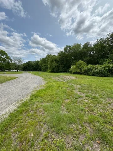 a view of a field with an ocean